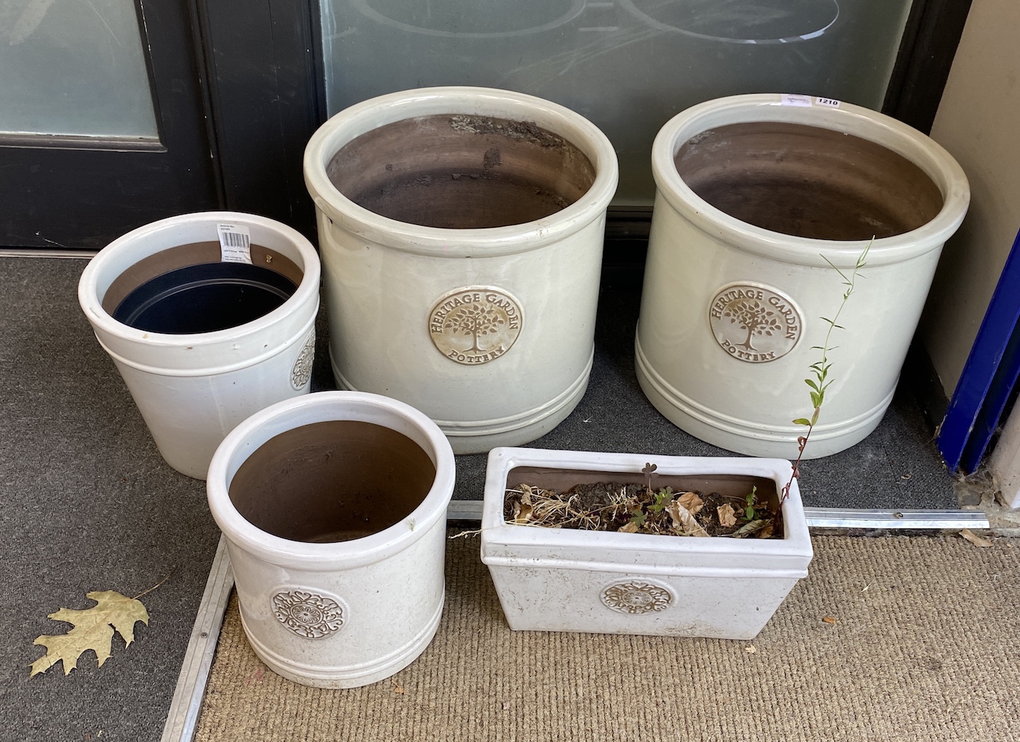 Five various Heritage Garden Pottery' garden urns, largest diameter 38cm, height 34cm